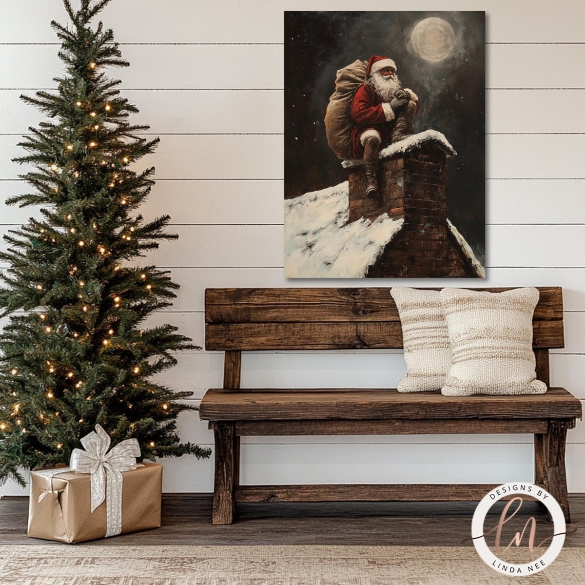 Santa rooftop wall art hung above a wooden bench beside a decorated tree