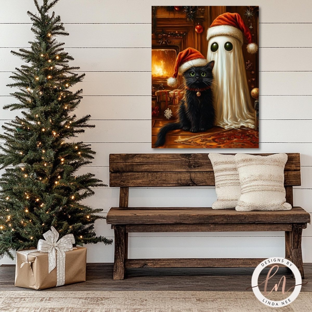Ghost and cat Christmas print hung above a wooden bench beside a decorated tree