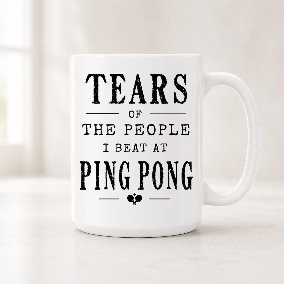 15 oz Tears of the People I Beat at Ping Pong mug with bold black vintage lettering and a small themed icon