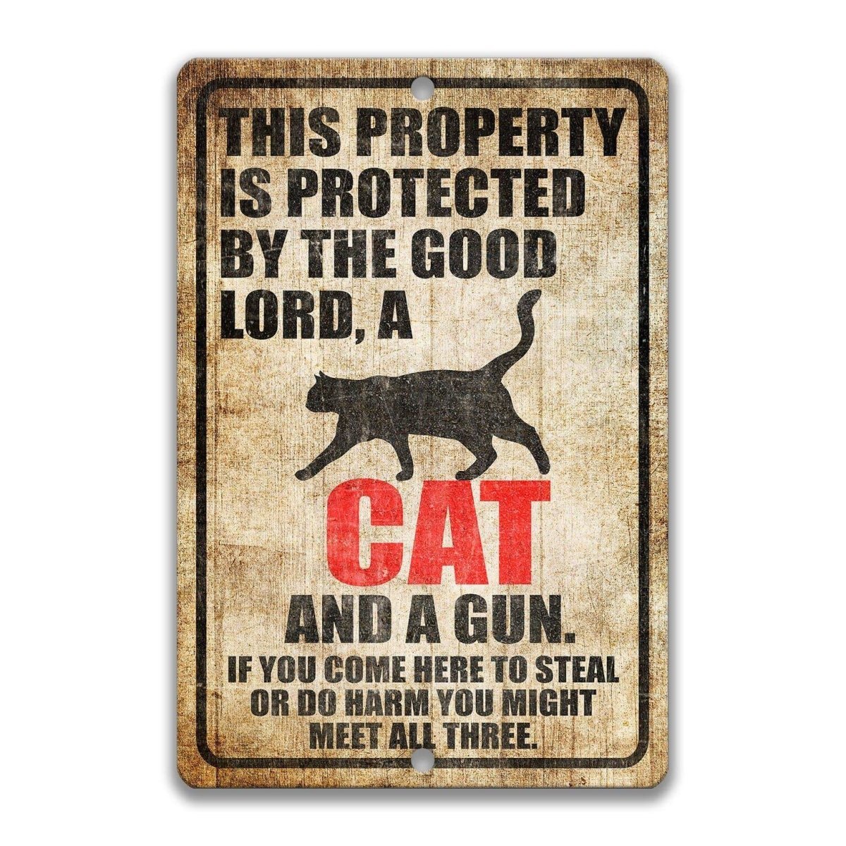 The image is a sign that reads "This property is protected by the good Lord, a cat and a gun. If you come here to steal or do harm, you might meet all three."
