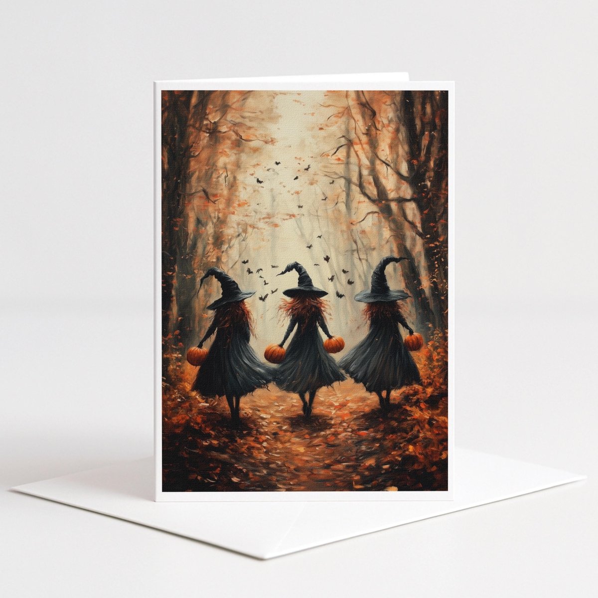Three witches carrying pumpkins through an autumn forest with bats, 5x7 note card