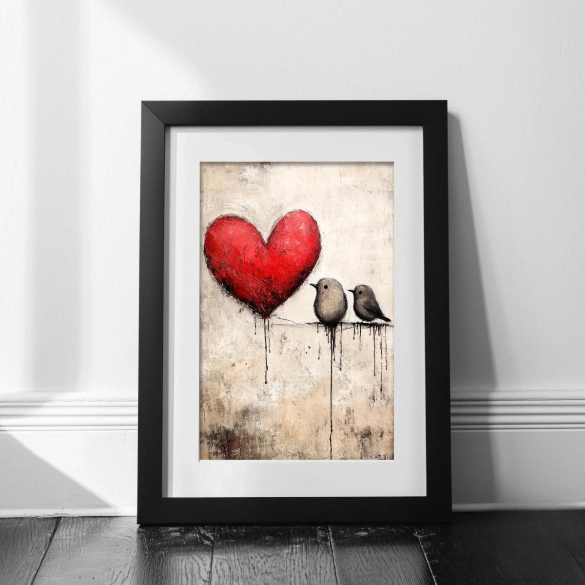The image is a framed artwork depicting two birds perched on a wire, with a large red heart in the background.