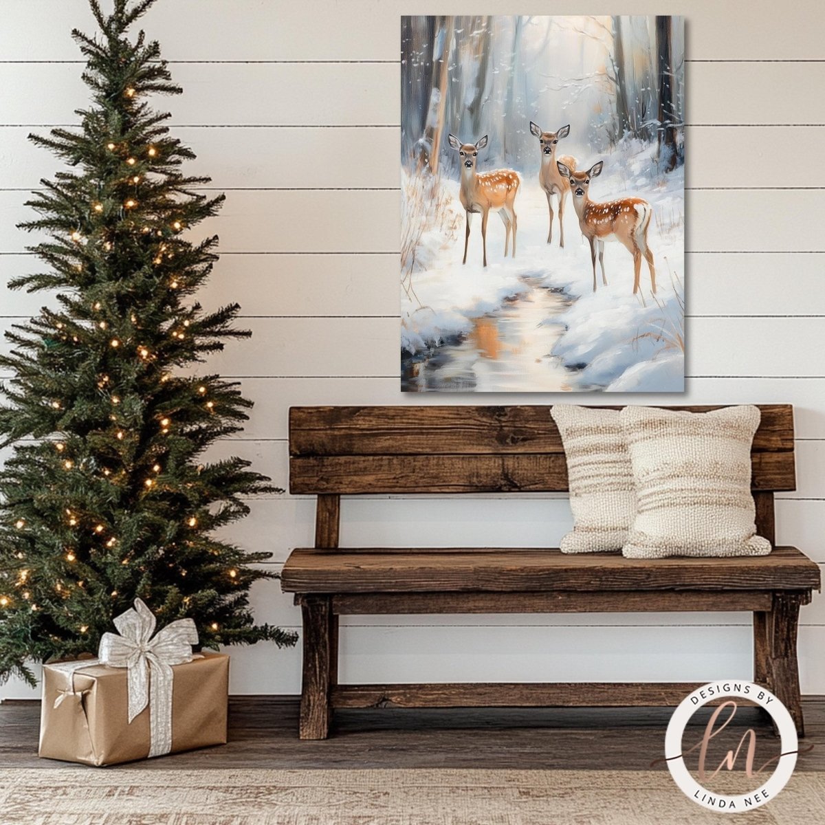 Winter stream deer artwork above a wooden bench beside a lit Christmas tree