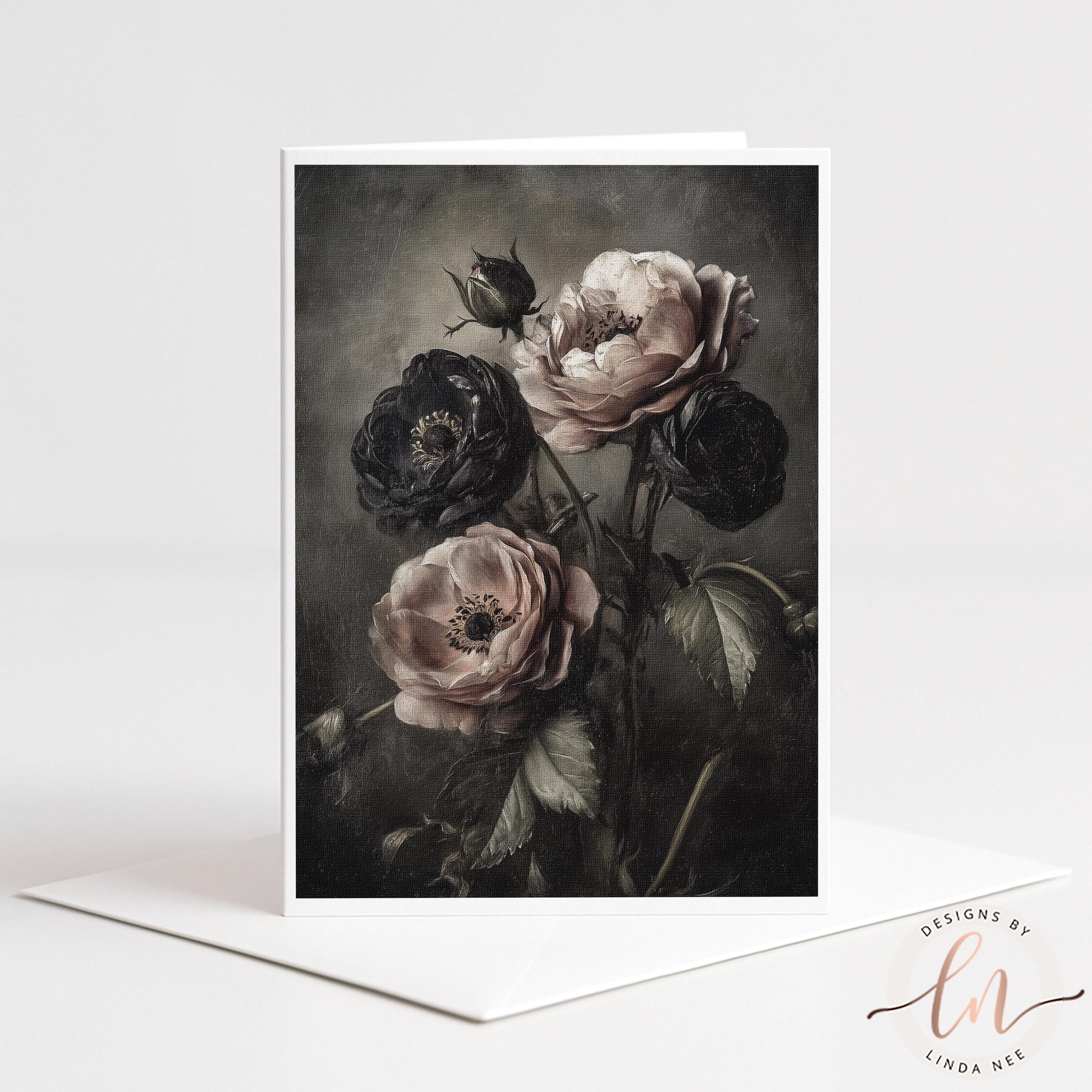A black and white image of a bouquet of roses with dark and light pink flowers, set against a dark background.