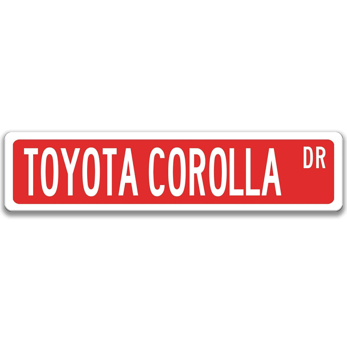 Red Toyota Corolla street sign with white border and white text reading TOYOTA COROLLA DR