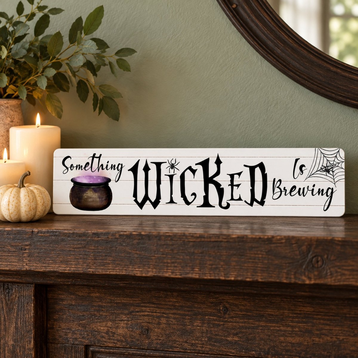 Something Wicked Is Brewing sign on a wood shelf with a pumpkin and candle