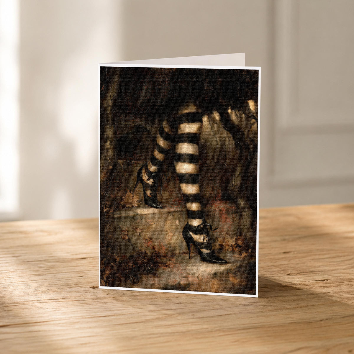 5x7 witch stockings blank note card standing upright showing its linen texture