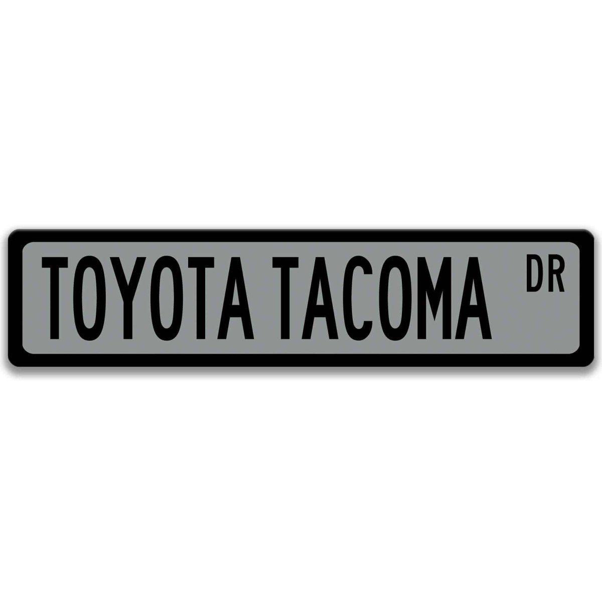 Gray street sign with black border, black text reading TOYOTA TACOMA DR