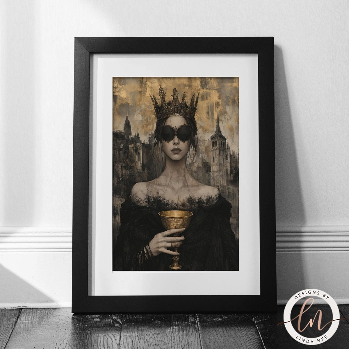 A framed artwork depicting a woman wearing a crown and holding a golden chalice, with a cityscape in the background.