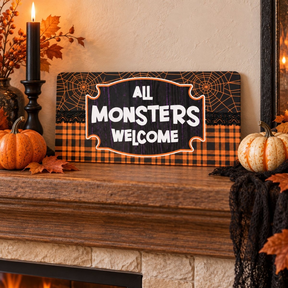 Plaid All Monsters Welcome sign on a mantel with Halloween decor