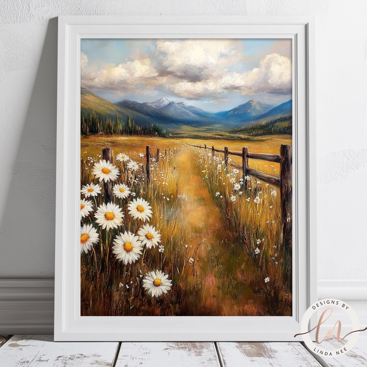 The image is a framed painting depicting a scenic countryside landscape with a field of white daisies, a wooden fence, and mountains in the background under a cloudy sky.
