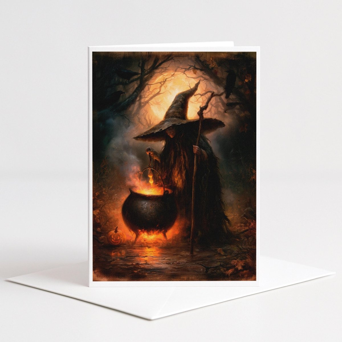 Witch and cauldron Halloween note card art of a cloaked witch over a glowing cauldron in a moonlit forest