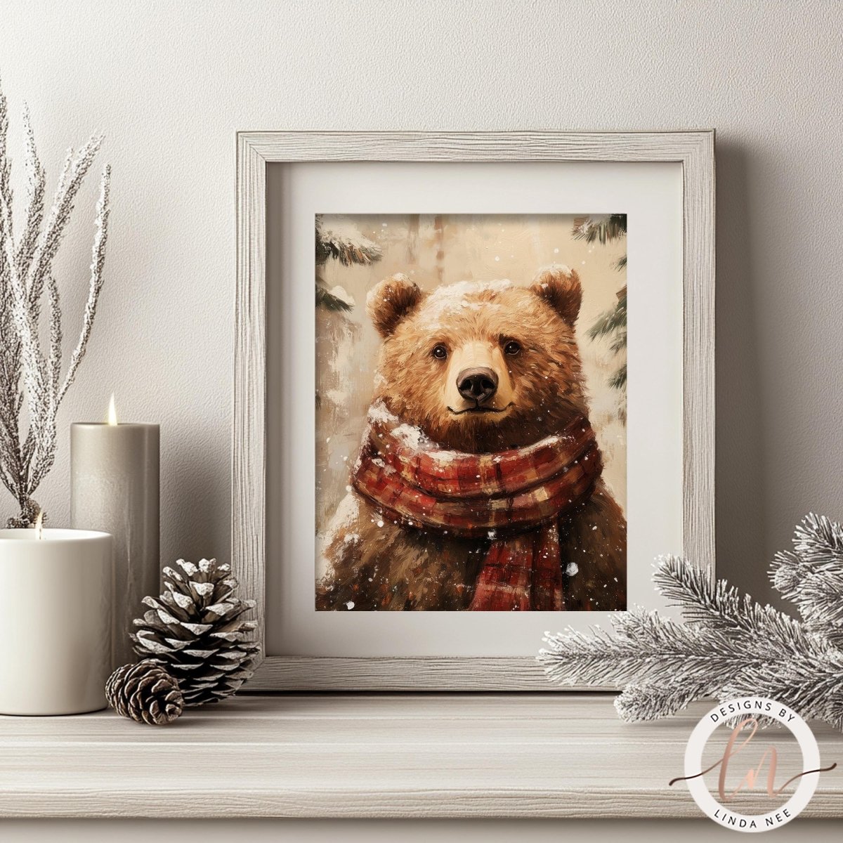 A framed print of a brown bear wearing a red and white scarf is displayed on a shelf, surrounded by candles and pine cones.