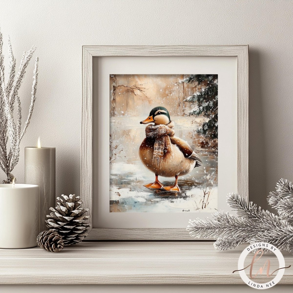 A framed painting of a duck wearing a scarf, set against a snowy winter landscape, is displayed on a shelf with a pine cone and a candle.