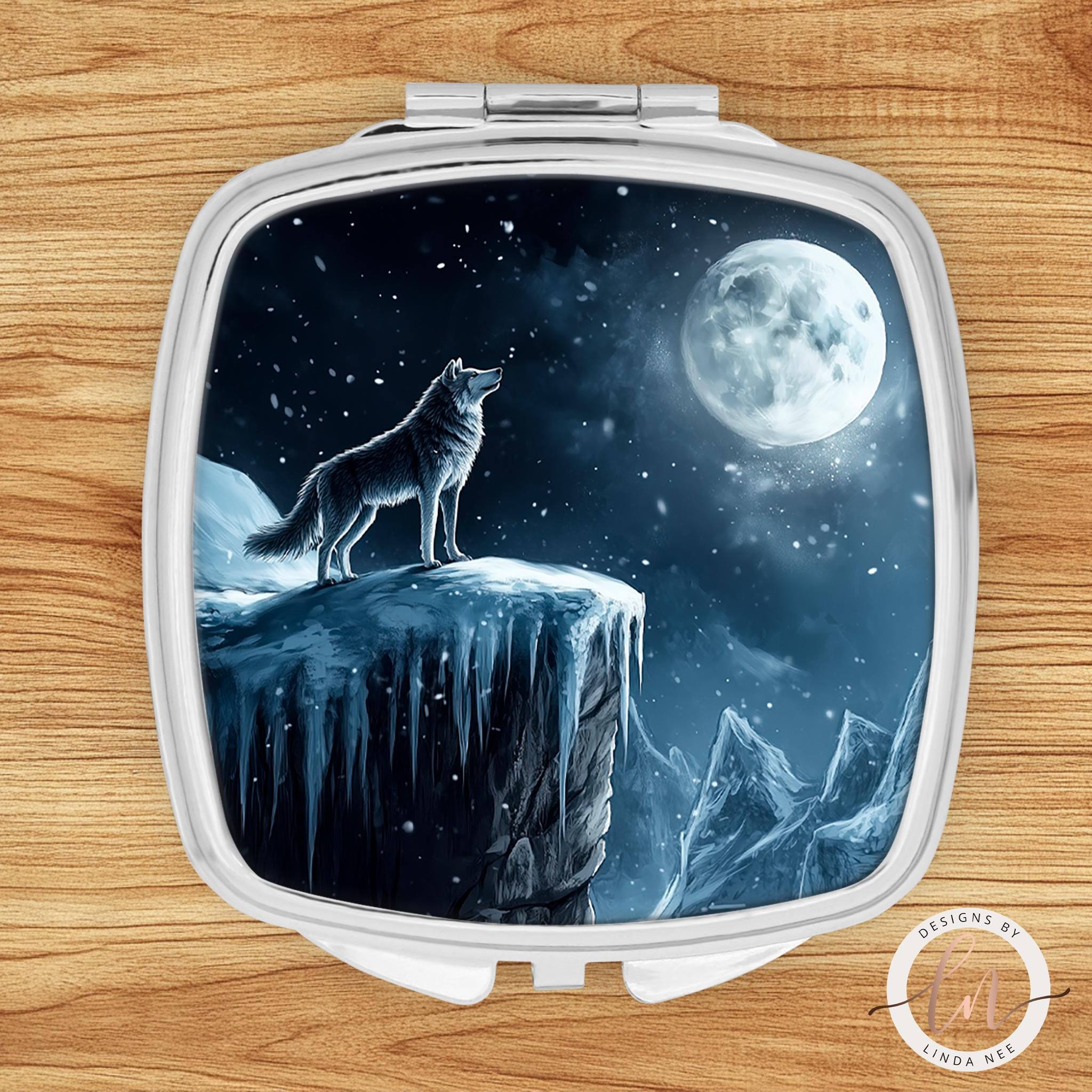Howling wolf compact mirror with winter moon scene on silver square case
