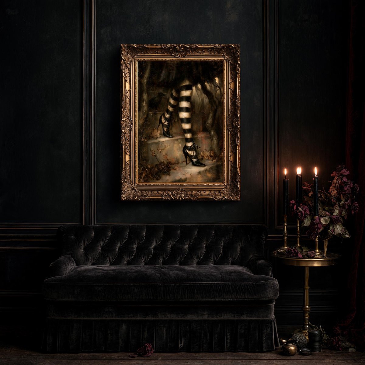 Large striped stockings artwork above a black tufted sofa and a table of candles