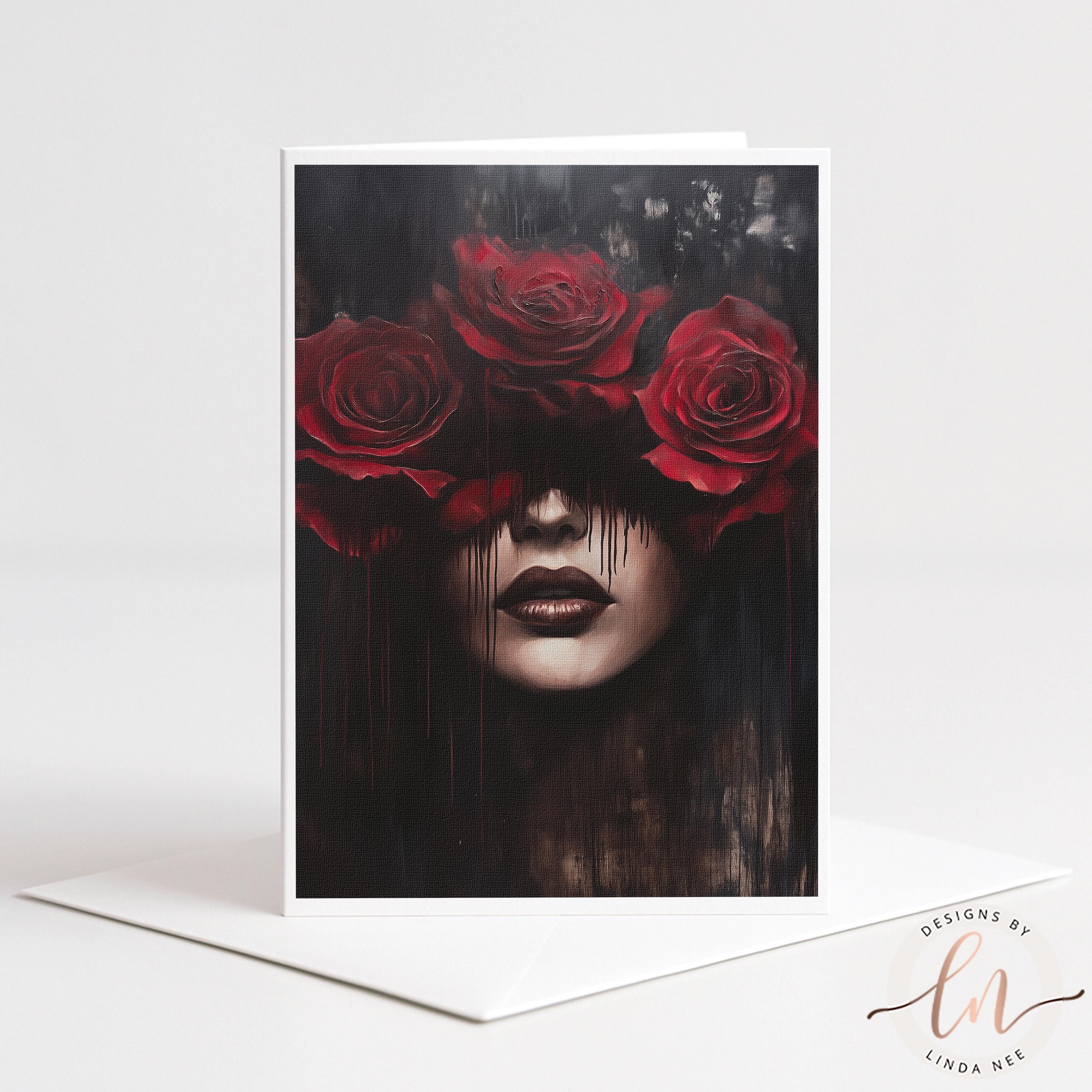 A 5x7 linen-textured greeting card featuring a dark, surreal illustration of a woman with red roses covering her eyes. The card showcases a gothic and moody floral theme with dripping paint effects, shown next to a premium white envelope on a neutral background.