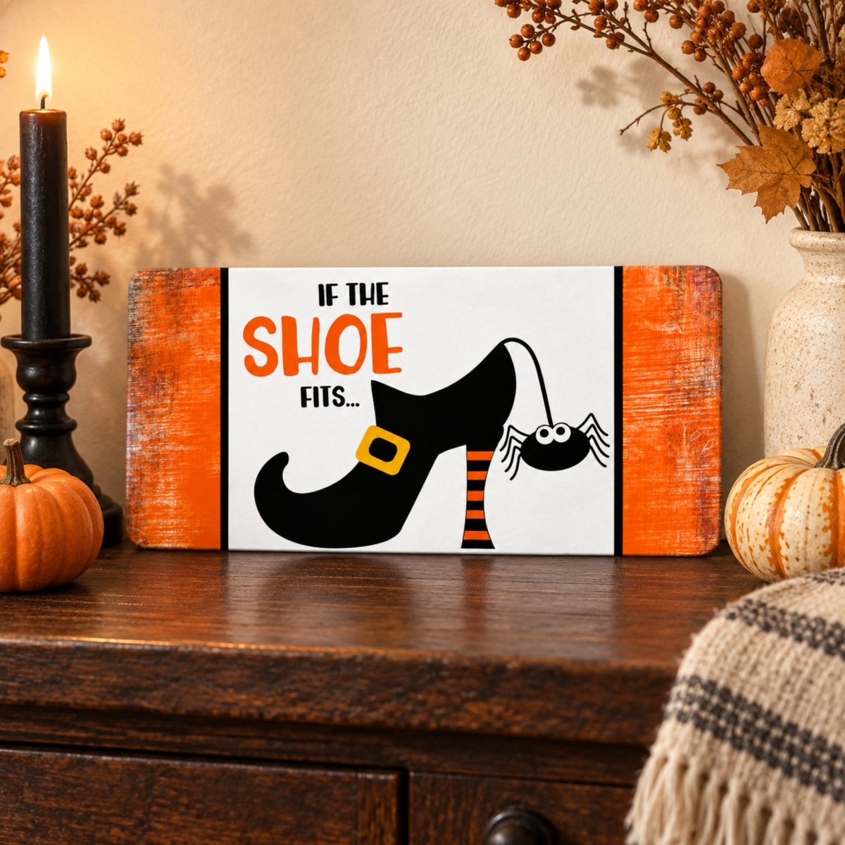 Witch Shoe and Spider sign on a shelf with fall decor