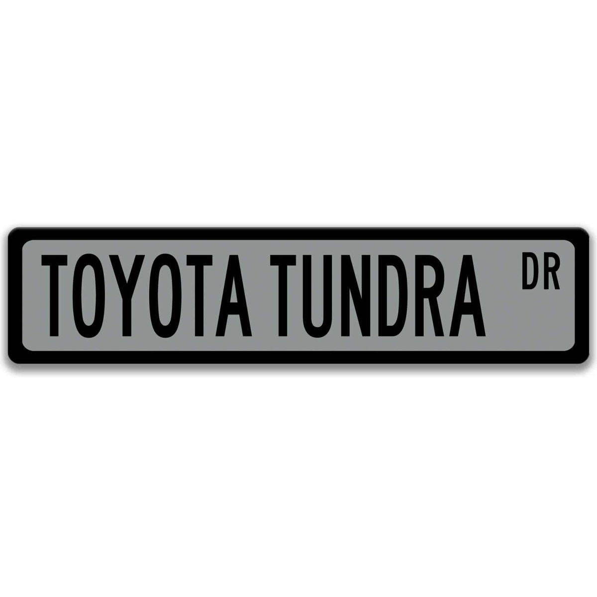 Gray street sign with black border, black text reading TOYOTA TUNDRA DR