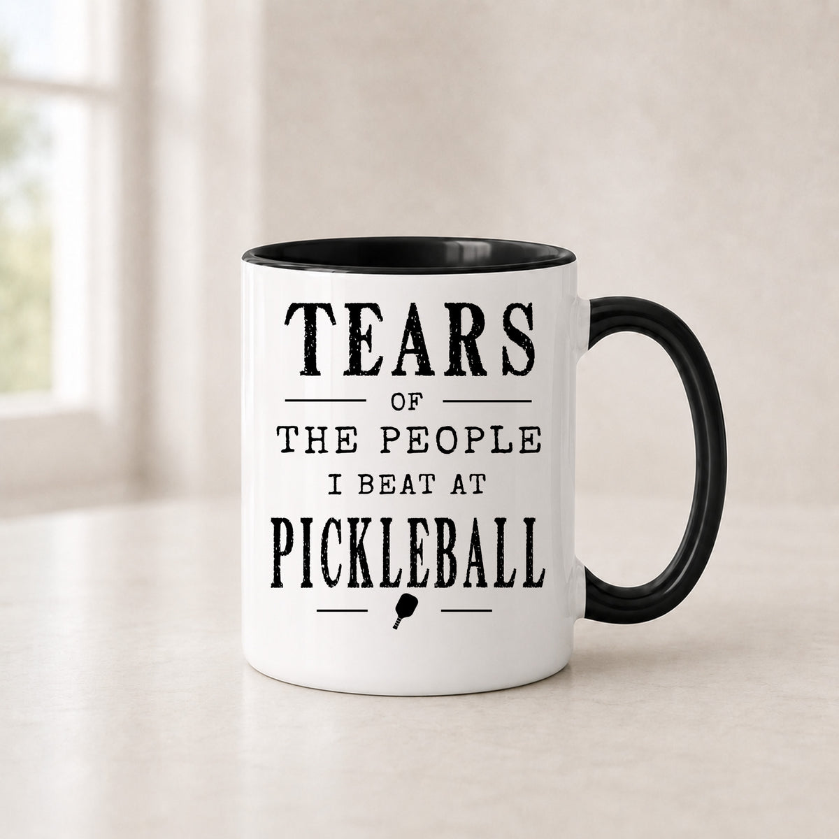 Tears of the People I Beat at Pickleball mug in the 11 oz black handle version with a black interior