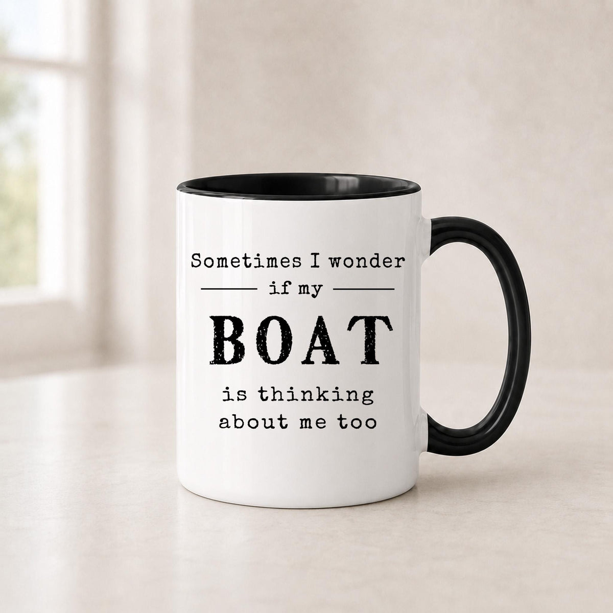 Third angle of the funny boat mug with its clean black lettering on glossy white ceramic