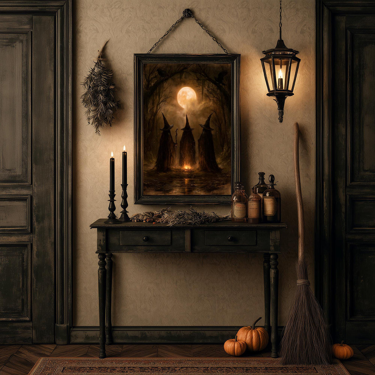 Halloween table of candles, pumpkins, a broom, and a lantern below the witch print
