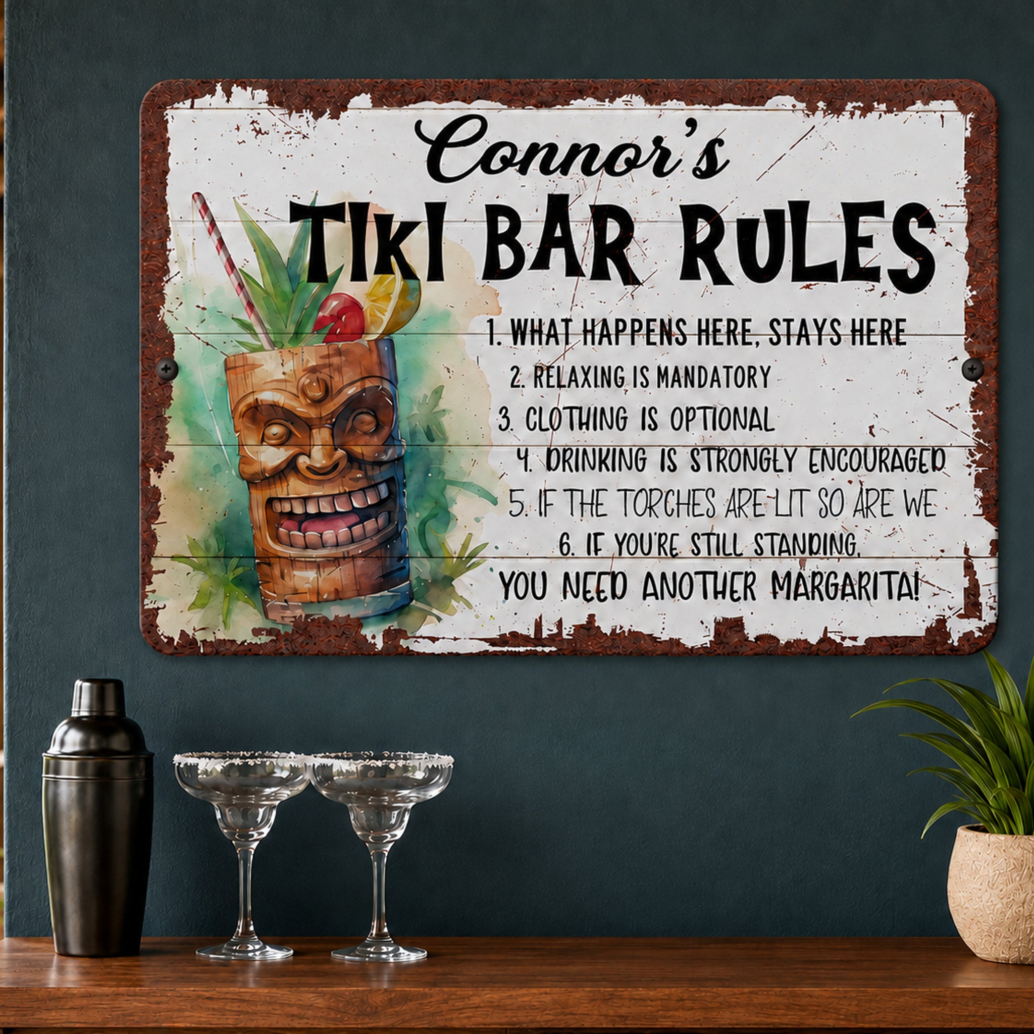 a sign with humorous rules for a tiki bar, accompanied by a tiki mask and a cocktail shaker on a wooden shelf.