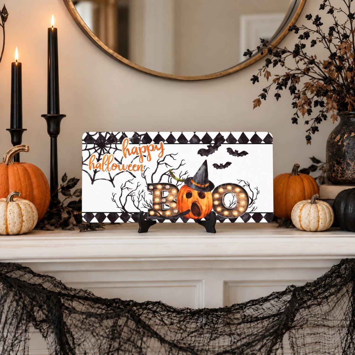 Happy Halloween Bats and Pumpkin sign on a mantel with Halloween decor