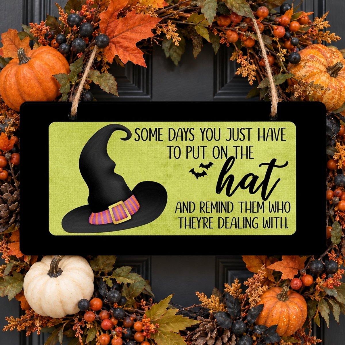 Black Put On the Hat sign centered in a door wreath