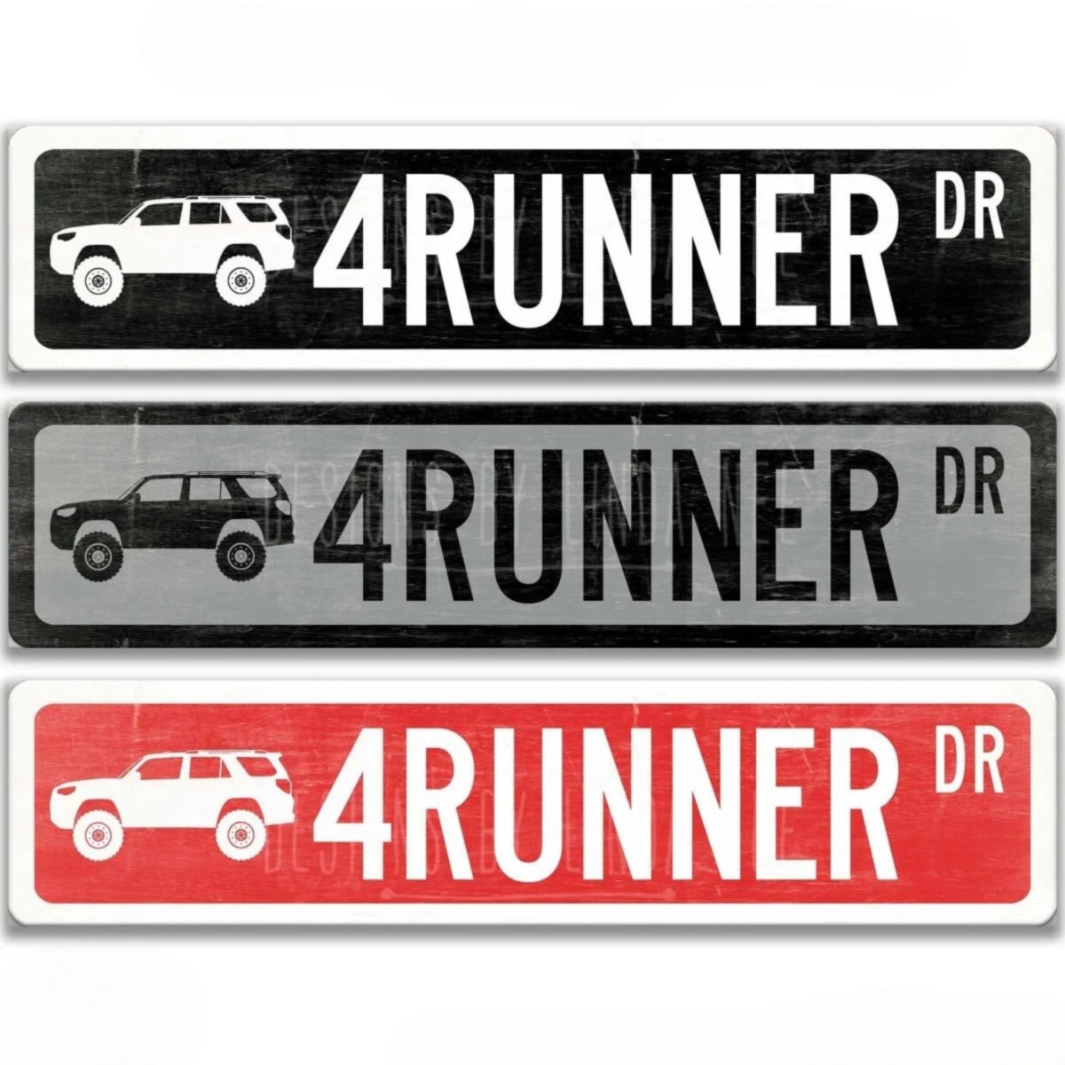 three different street signs for the street named "4 Runner Dr", each with a different color and design.