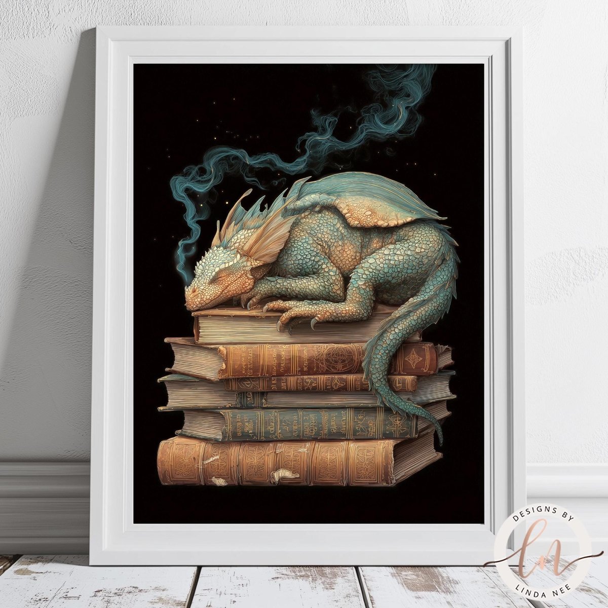 A framed illustration depicting a sleeping dragon resting on a stack of books.