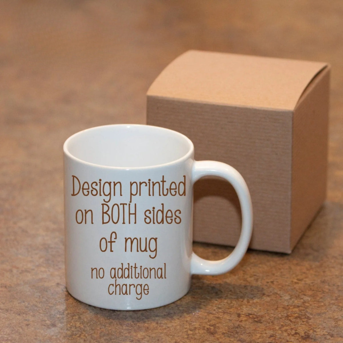 White mug in front of a kraft gift box with text saying the design is printed on both sides at no additional charge