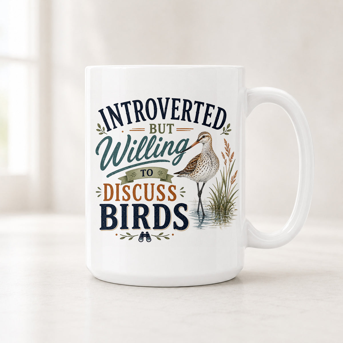 15 oz shorebird mug with a spotted sandpiper in marsh grass and the quote Introverted But Willing to Discuss Birds