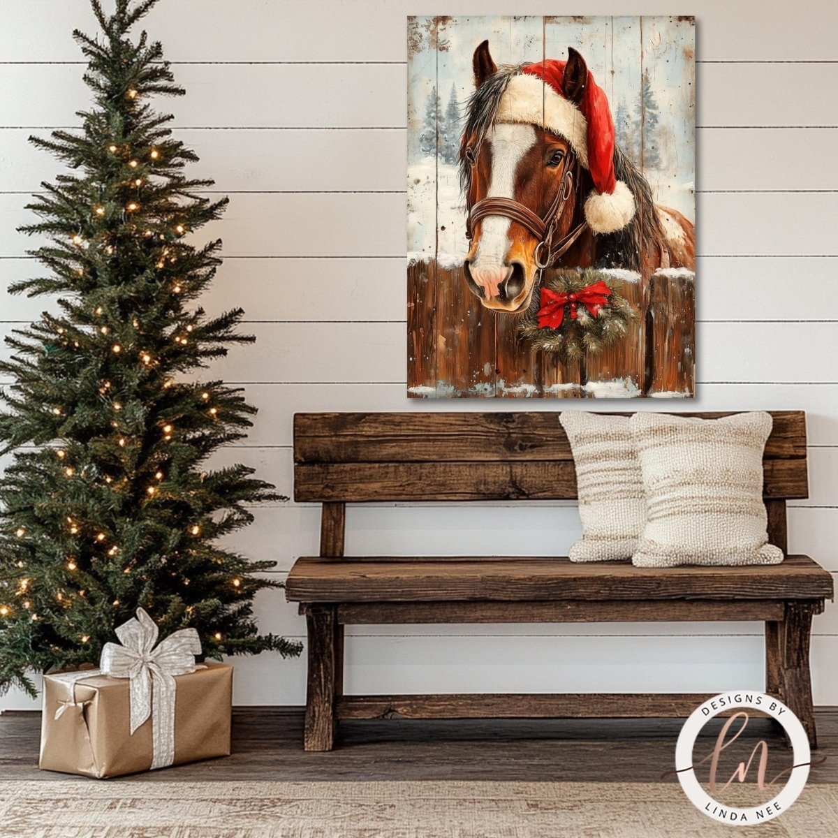 a wooden bench with a Christmas tree and a wreath on a wall, along with a framed painting of a horse wearing a Santa hat.