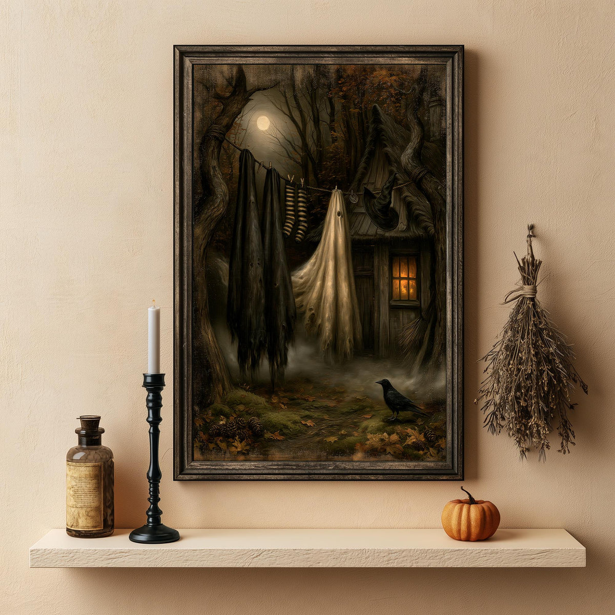 Witch laundry art print above a shelf with a candle, a bottle, and a small pumpkin