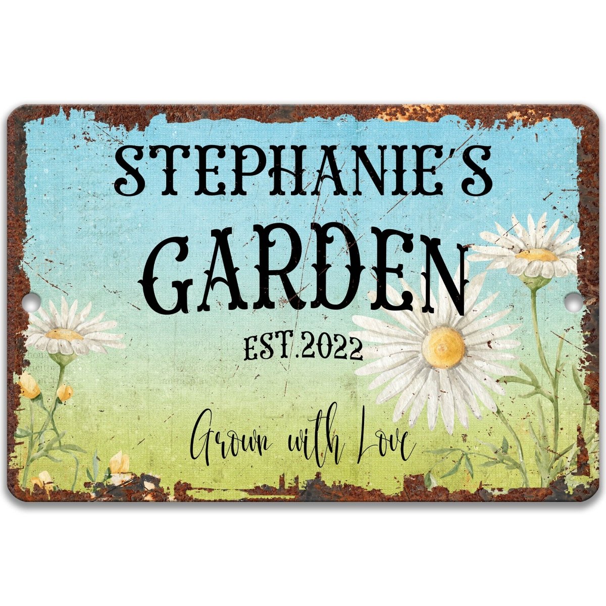 The image is a sign for Stephanie's Garden, featuring a rustic, vintage-style design with a blue background and white flowers.