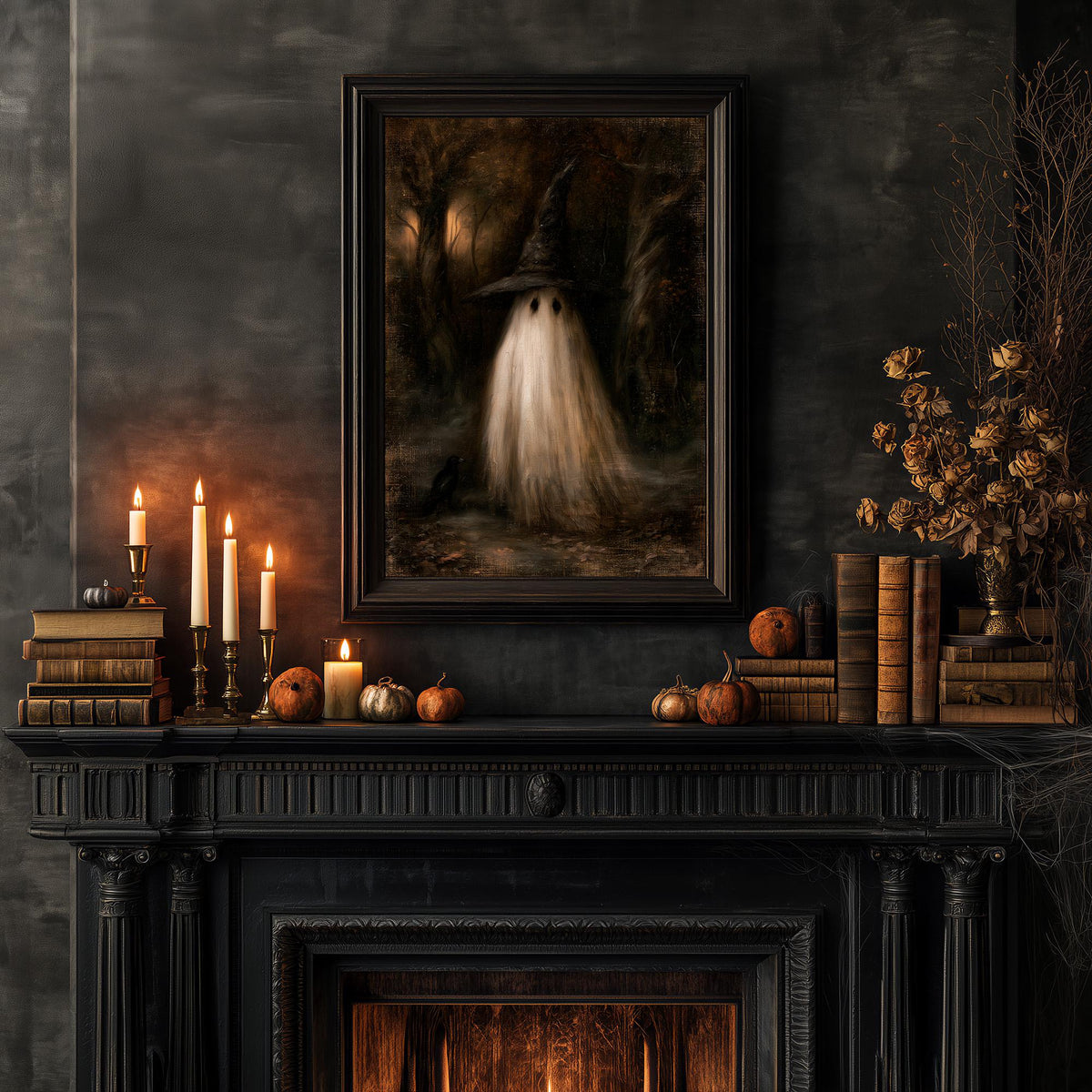 Halloween mantel with candles, pumpkins, and books beneath the ghost witch print