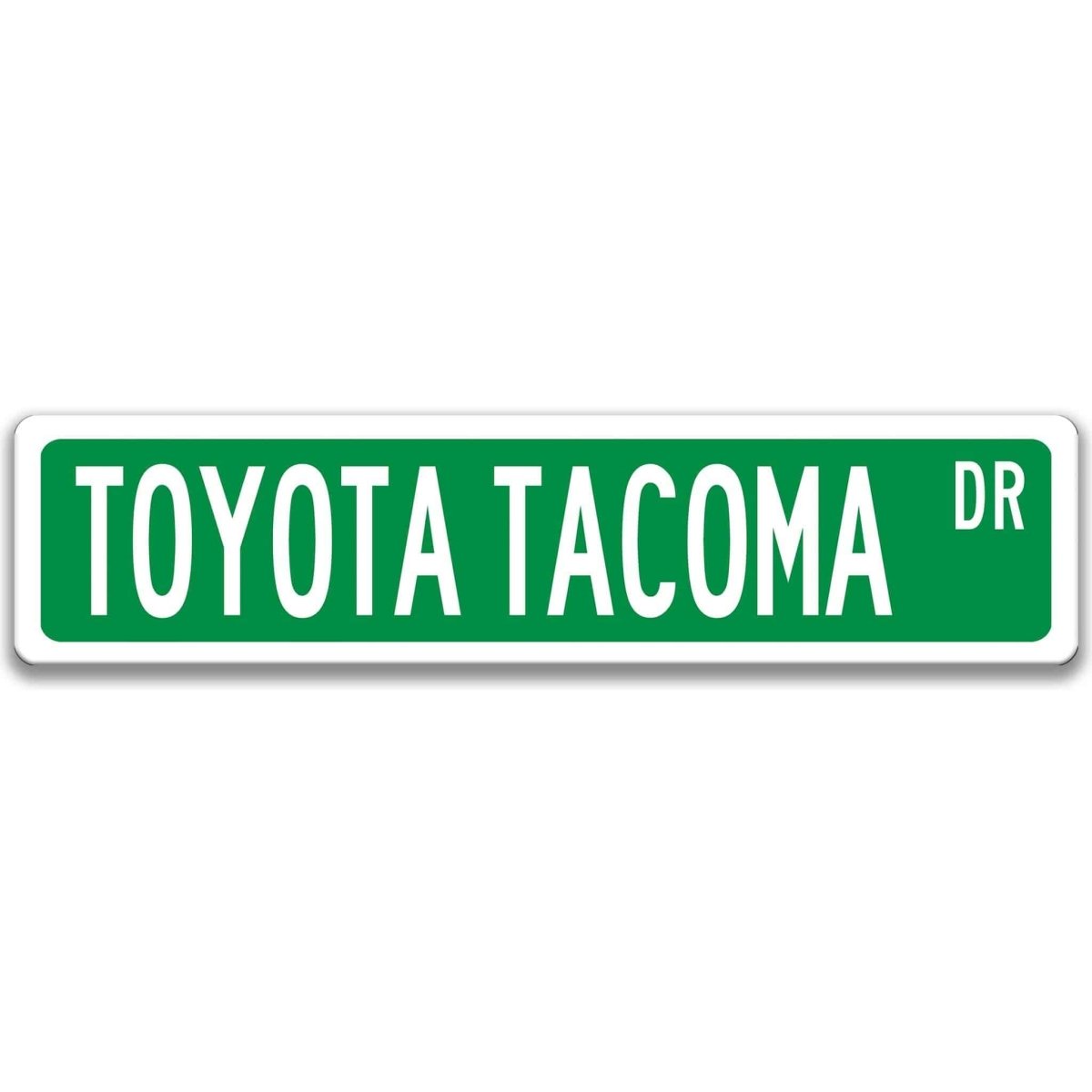 Green street sign with white border, white text reading TOYOTA TACOMA DR