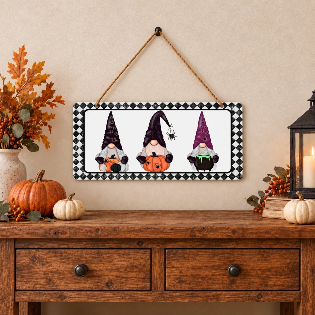 Three Halloween Gnomes sign on a wall above a table
