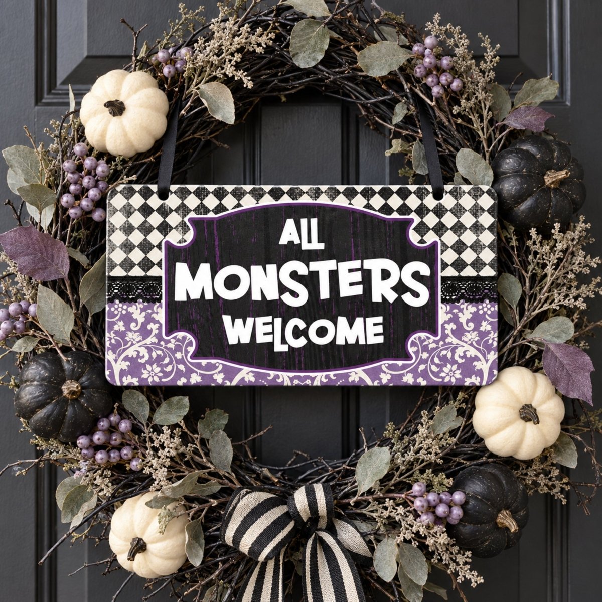 Purple All Monsters Welcome sign centered in a door wreath