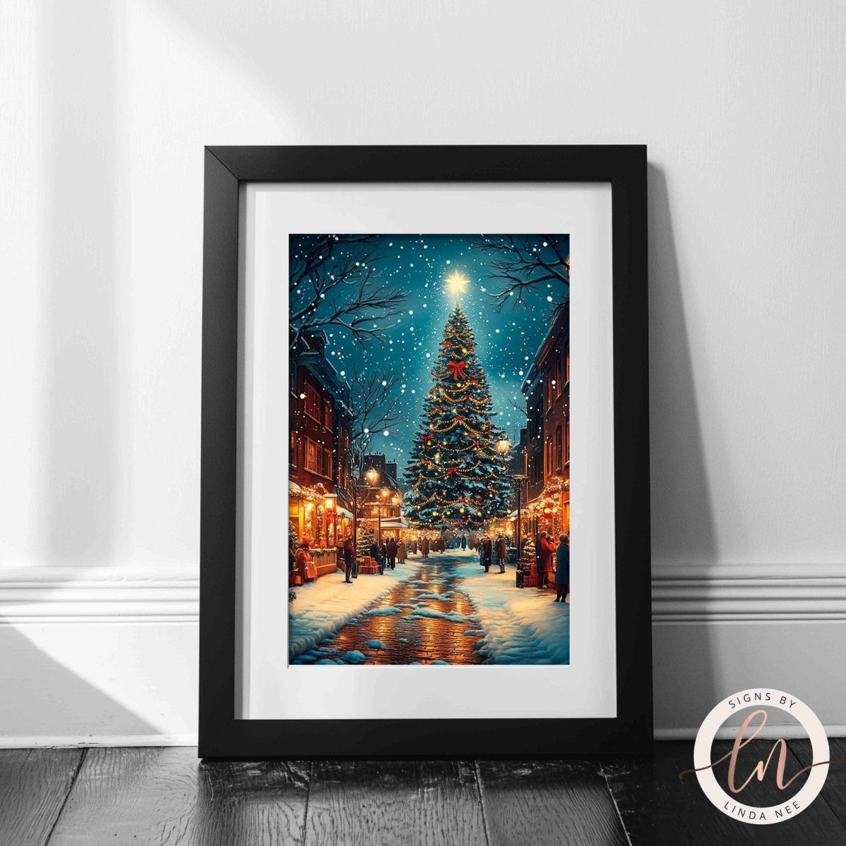 Christmas city wall art displayed with garlands, candles and ornaments