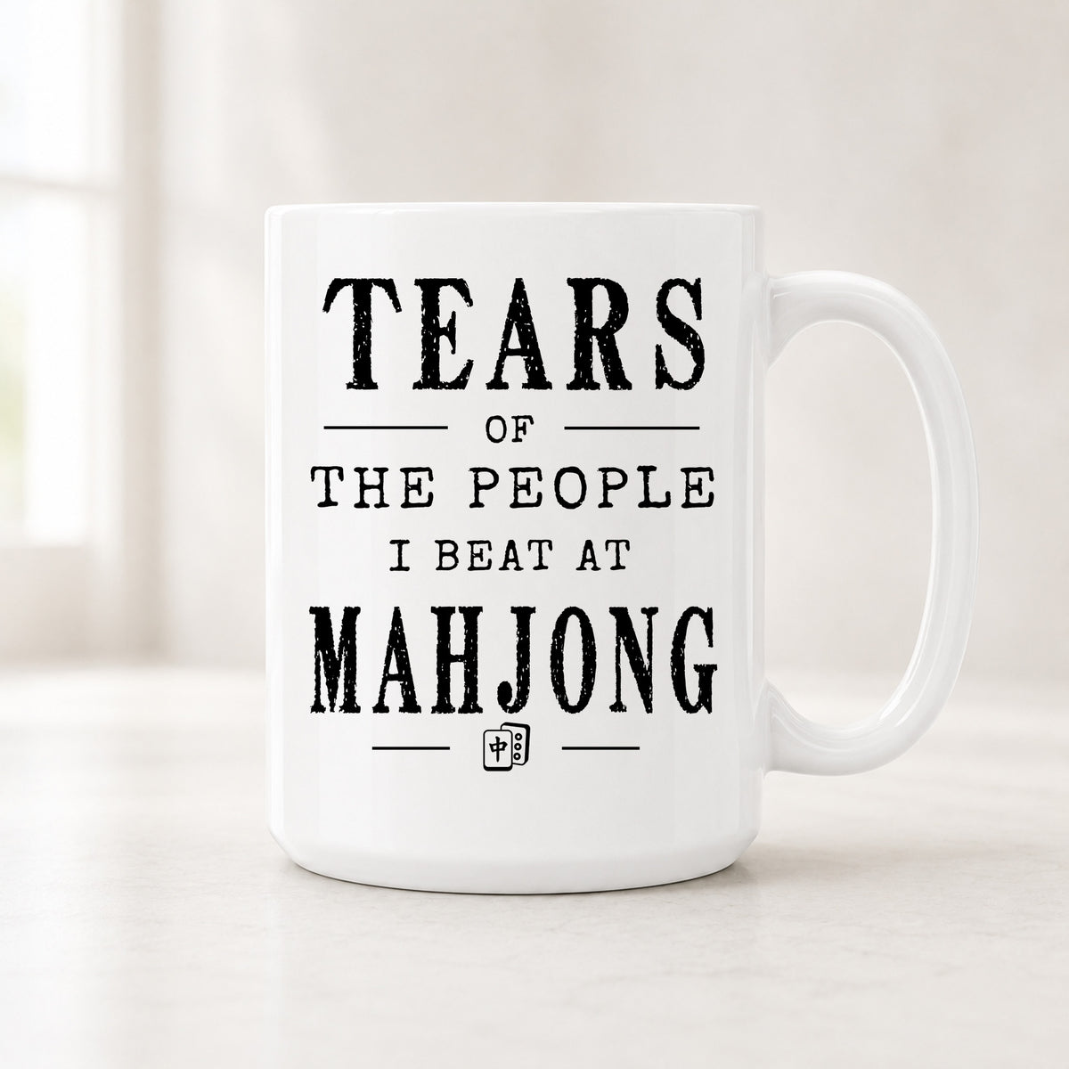 15 oz Tears of the People I Beat at Mahjong mug with bold black vintage lettering and a small mahjong tile icon