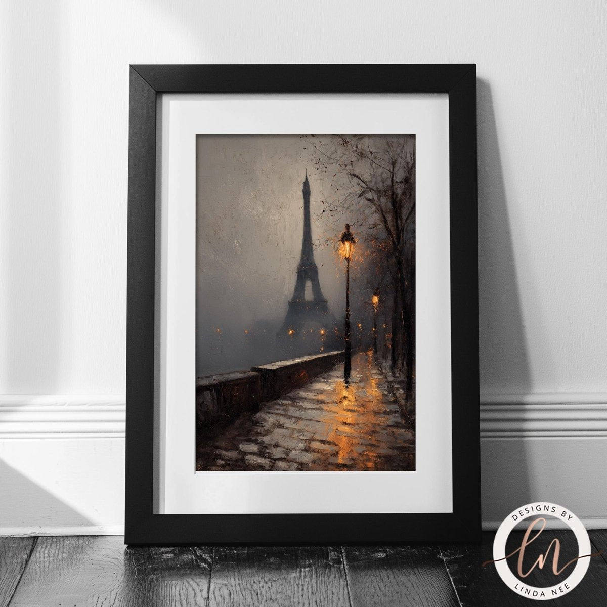 The image is a framed painting depicting a nighttime scene of the Eiffel Tower in Paris, France, with a foggy atmosphere and a street lamp illuminating the path.
