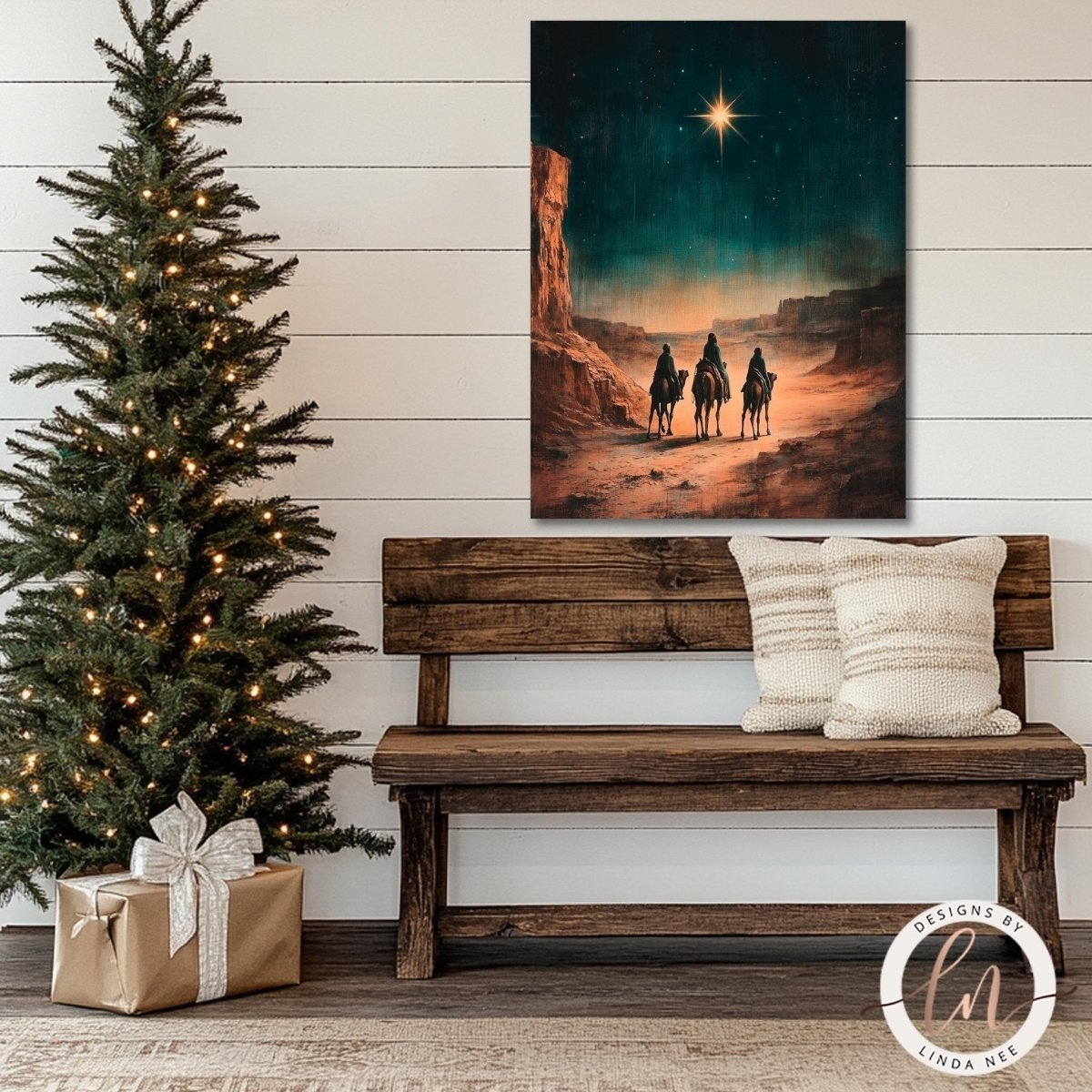 Nativity wall art displayed above a wooden bench beside a lit tree