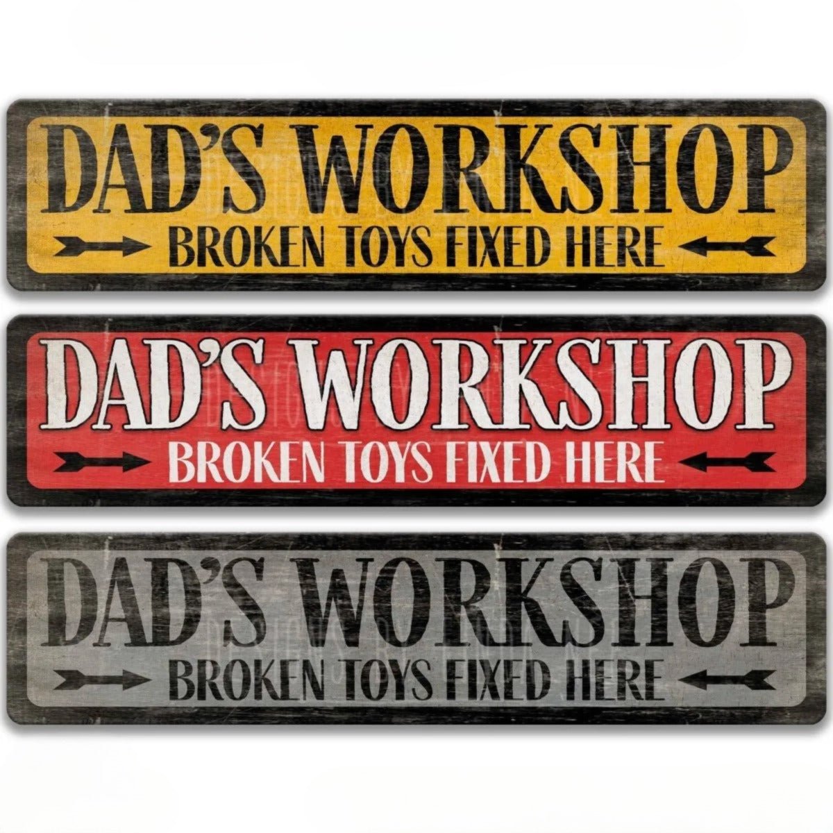 three signs that say "DAD'S WORKSHOP BROKEN TOYS FOUNDED HERE" in different colors and styles.
