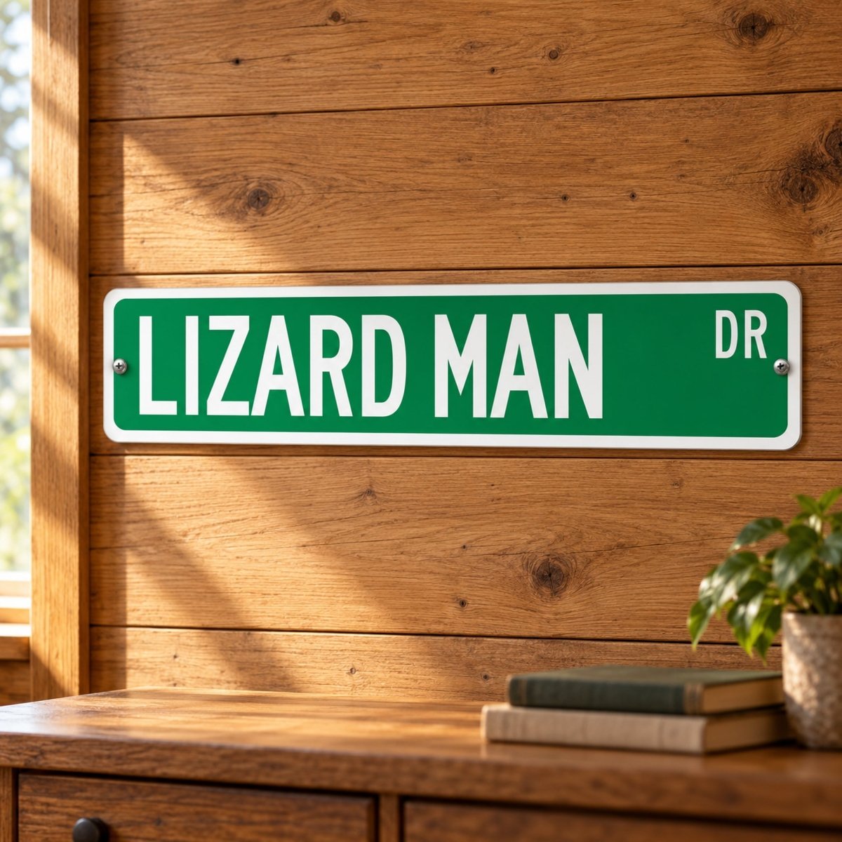 Lizard Man street sign with a green background reading LIZARD MAN DR, hanging on a wall