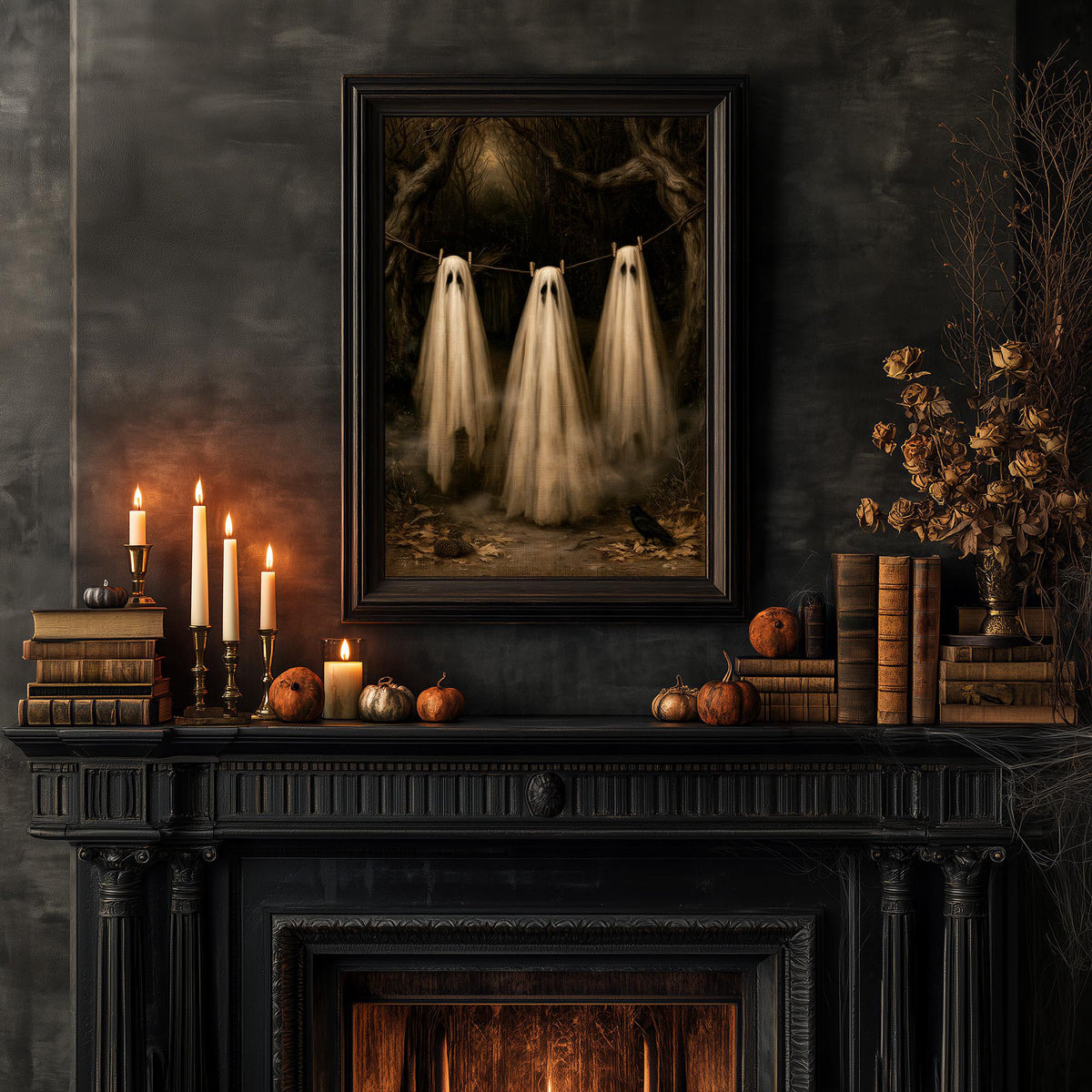 Halloween mantel styled with books, pumpkins, candles, and the ghost clothesline print