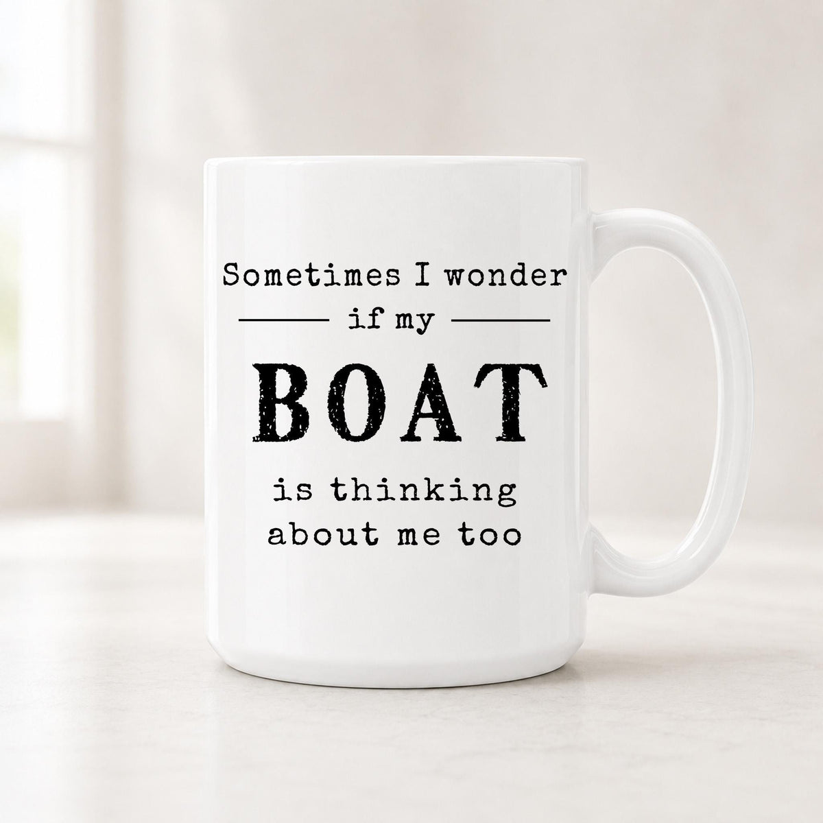 Sometimes I Wonder If My Boat Is Thinking About Me Too mug, white ceramic with the quote in bold black type