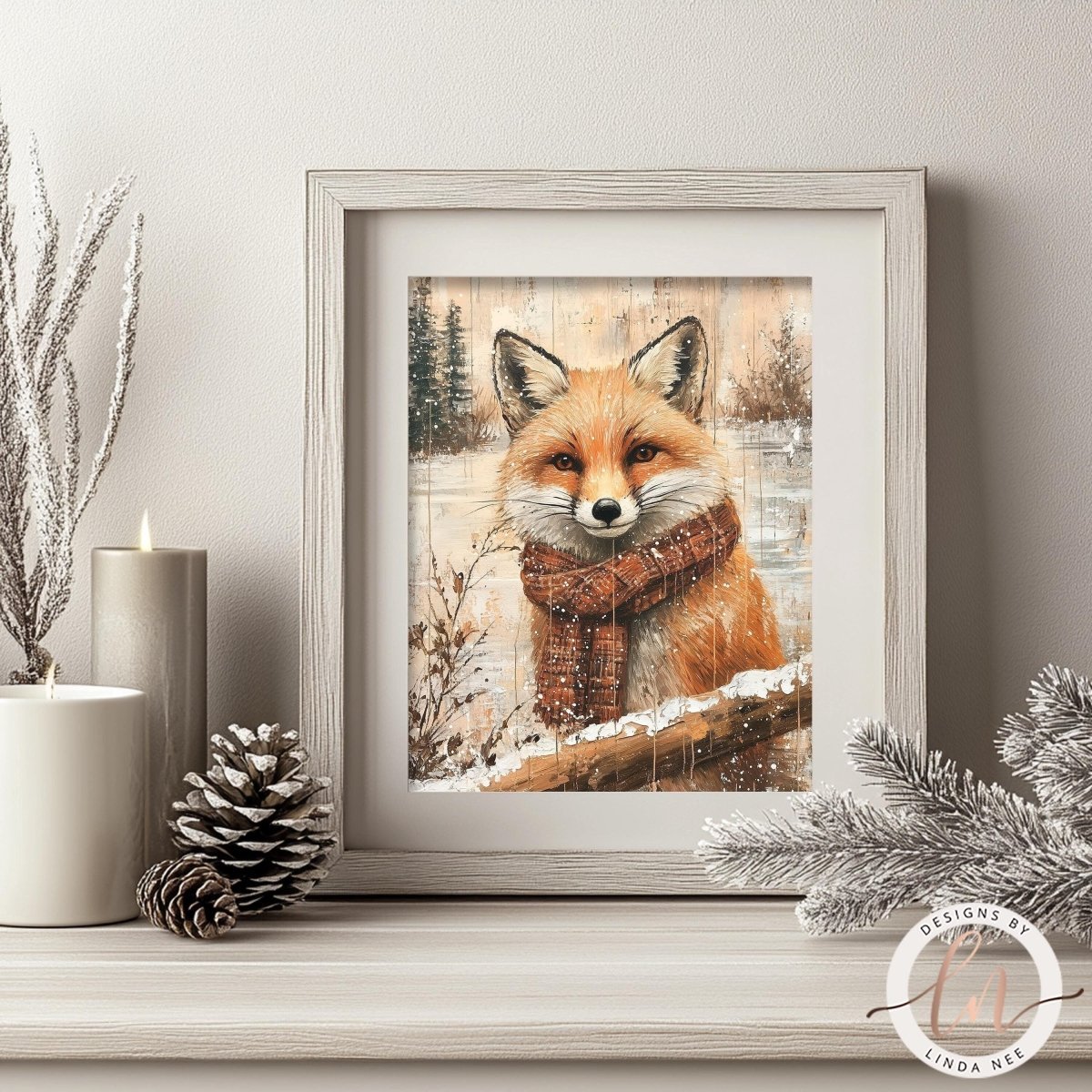 A framed print of a fox wearing a scarf is displayed on a shelf, surrounded by pine cones and a lit candle.