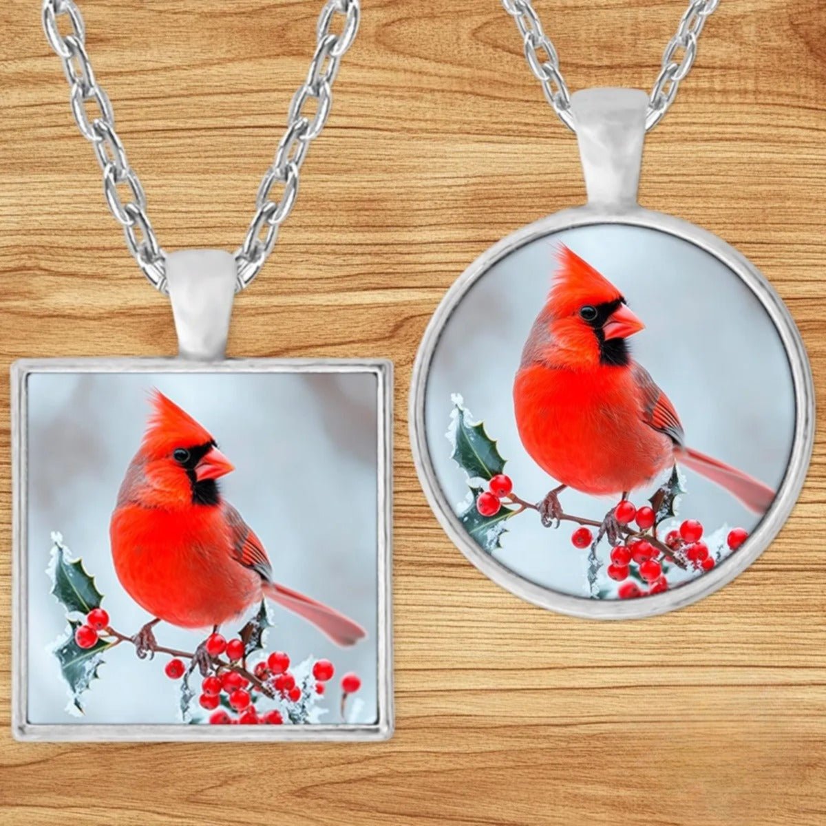 Red Cardinal Memorial pendant necklace shown in round and square silver charm styles on a wood background